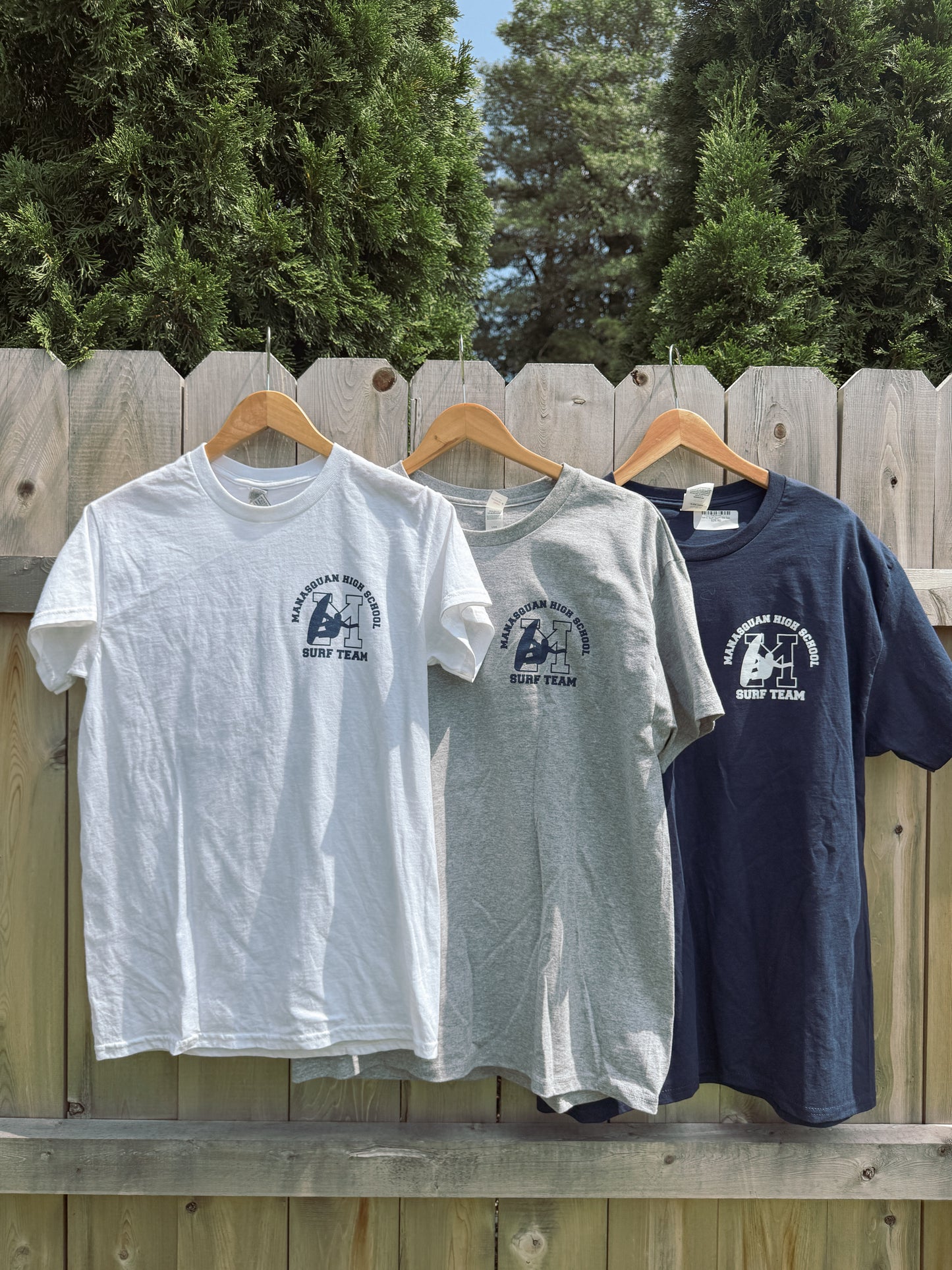Manasquan High School Surf team classic unisex tee featuring a front logo hit and full back graphic. Soft, comfortable, and made for life on and off the beach. 100% Cotton
